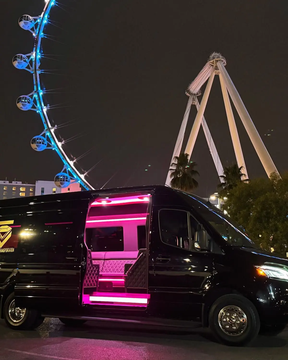 Black passenger van with an illuminated open side door