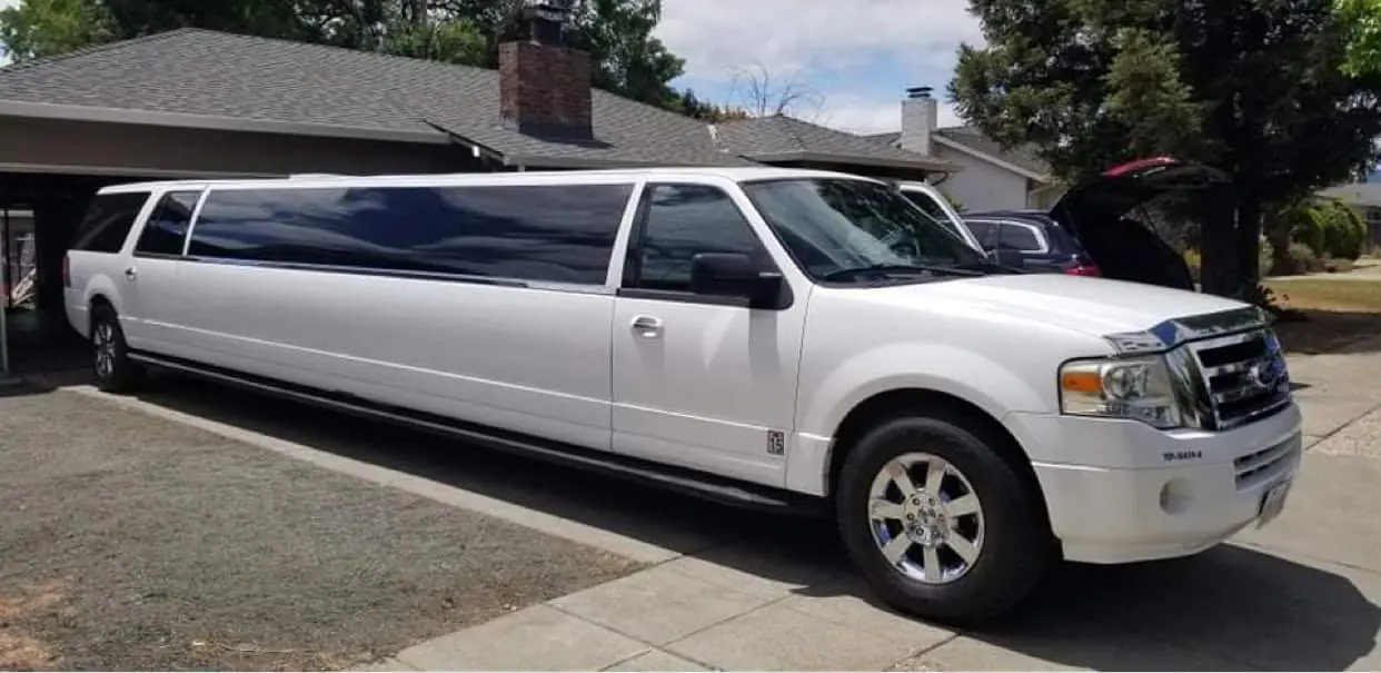 White stretch SUV limousine in daylight